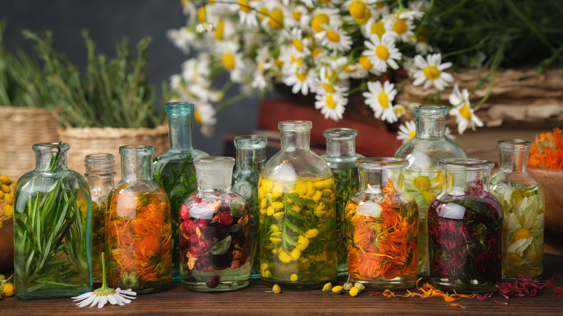 Bottles of essential oil infused with medicinal plants