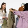 Friends exchanging clothes