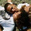 Two young people lying on grass