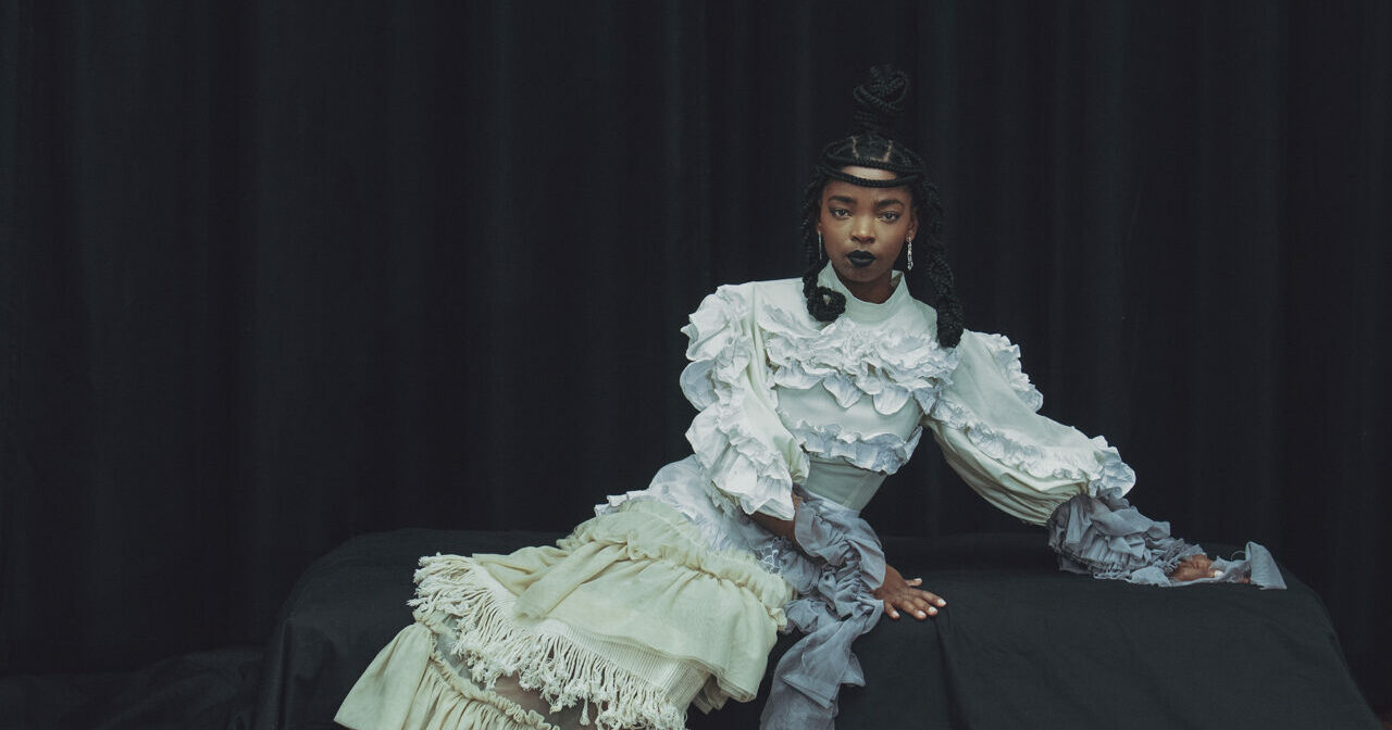 Model wearing a layered dress by Fikile Sokhulu