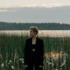 Woman Wearing Black Outfit Standing on Shallow Water