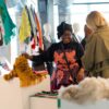 Two women browsing textile swatches at Africa Textile Talks 2023